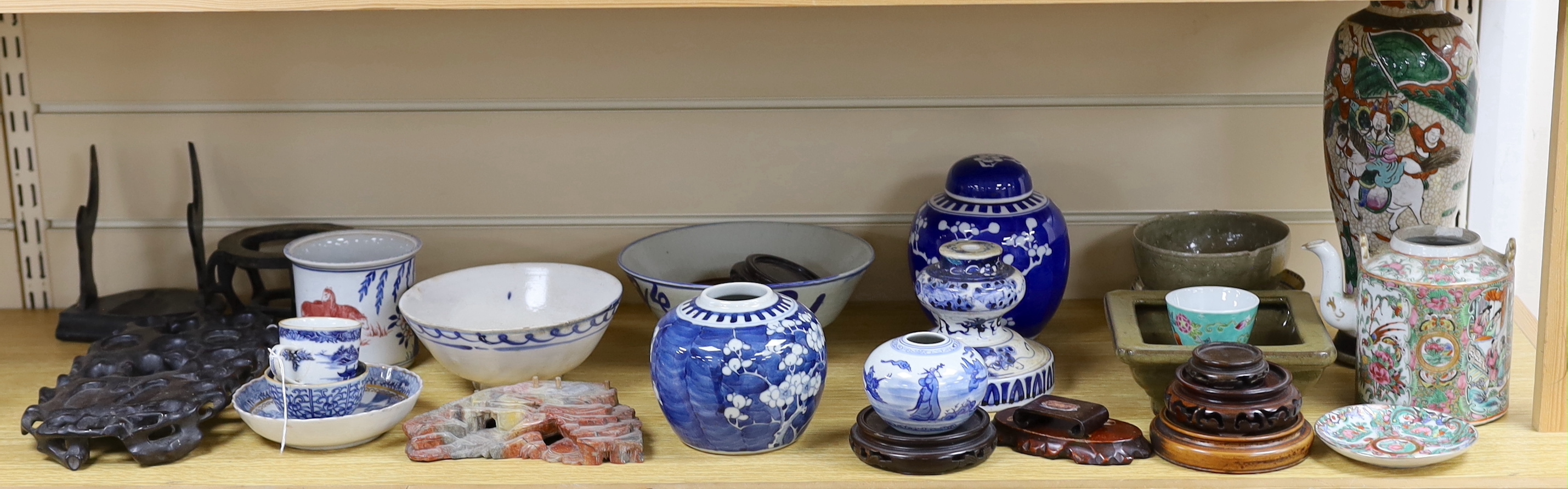 A collection of Chinese hardwood stands and a soapstone example, largest 29cm wide